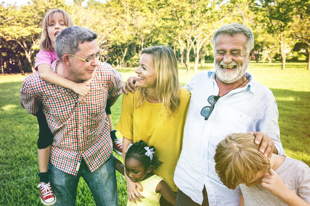 Group of adults and children smiling and laughing