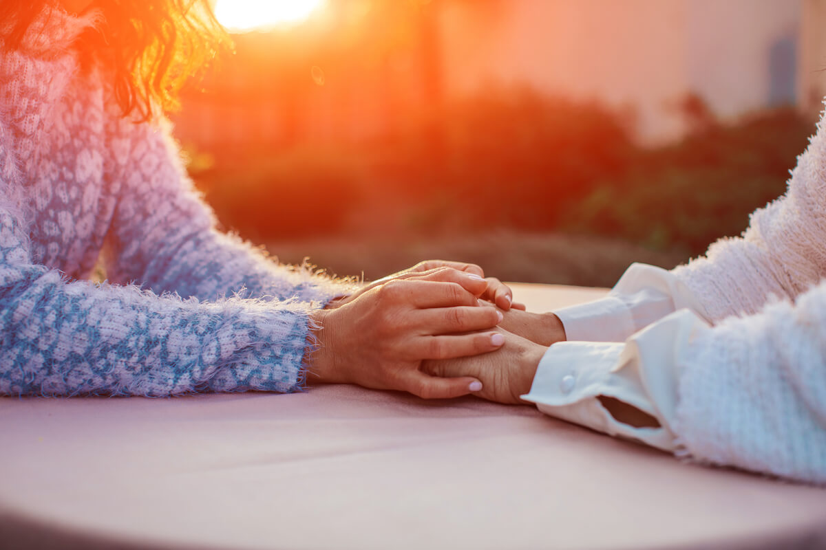 Caring hands holding eachother_Coping with a Dementia Diagnosis