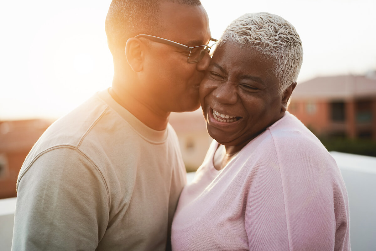 Man Kissing Older Woman on the Cheek-Dementia Support