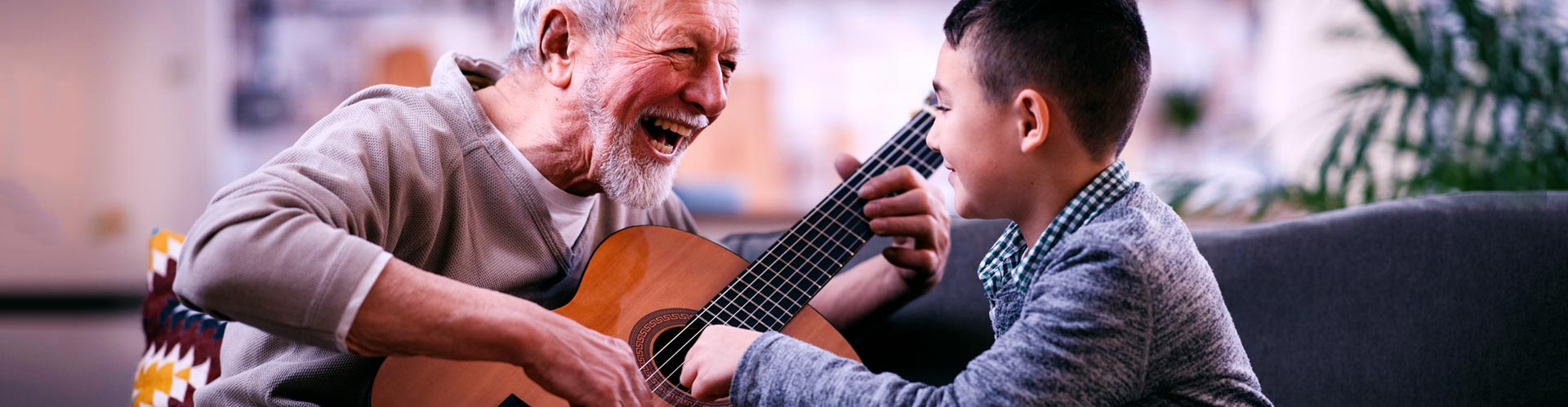 Senior playing guitar